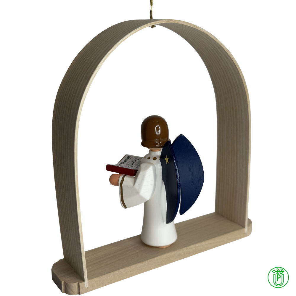 Angel with a book in the Christmas arch