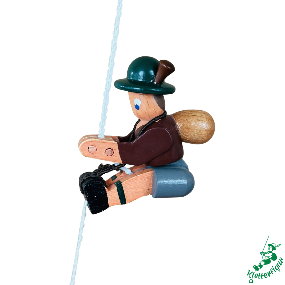 Climbing figure mountaineer with brown jacket